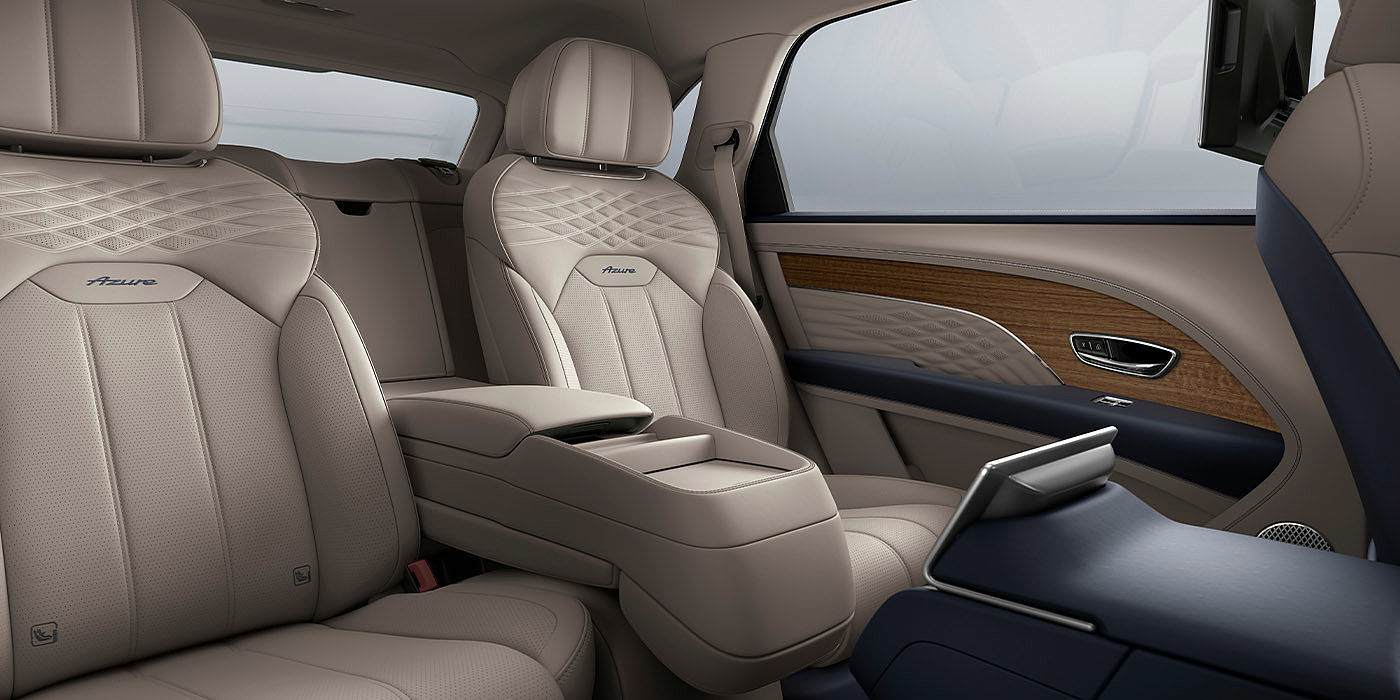 Bentley Beijing-Yizhuang Bentley Bentayga EWB Azure interior view for rear passengers with Portland hide featuring Azure Emblem in Imperial Blue contrast stitch.