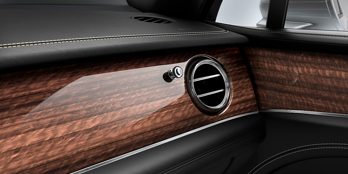 Bentley Beijing-Yizhuang Bentley Bentayga front interior Crown Cut Walnut veneer and chrome air vent.