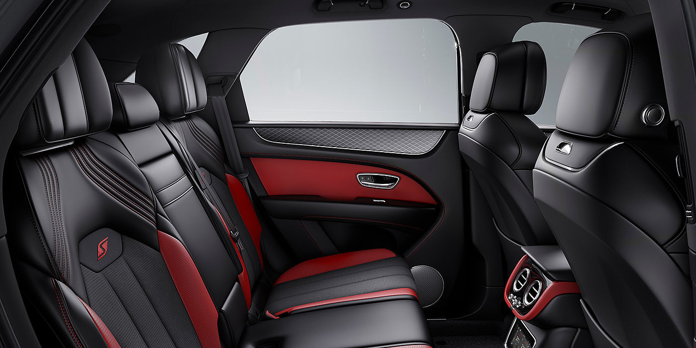 Bentley Beijing-Yizhuang Bentey Bentayga S interior view for rear passengers with Beluga black and Hotspur red coloured hide.
